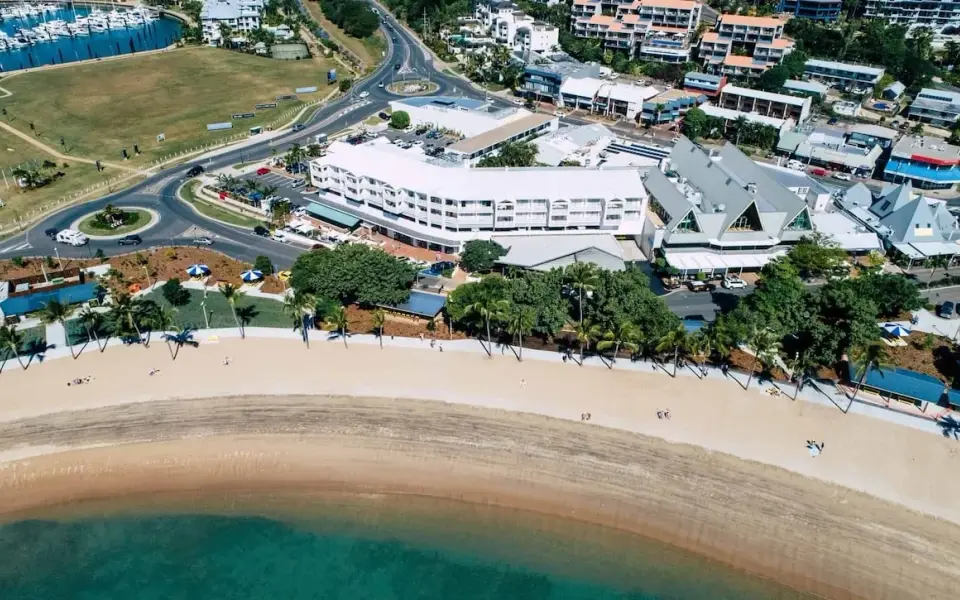 Airlie Beach Hotel building beside the Esplanade and beach