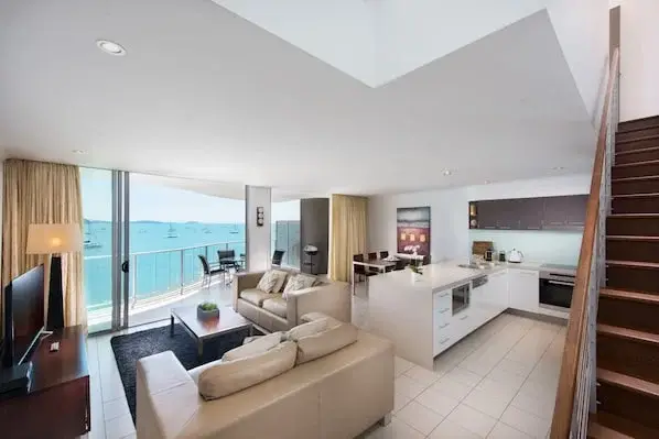 An apartment living room, dining area and kitchen pictured at Marina Shores
