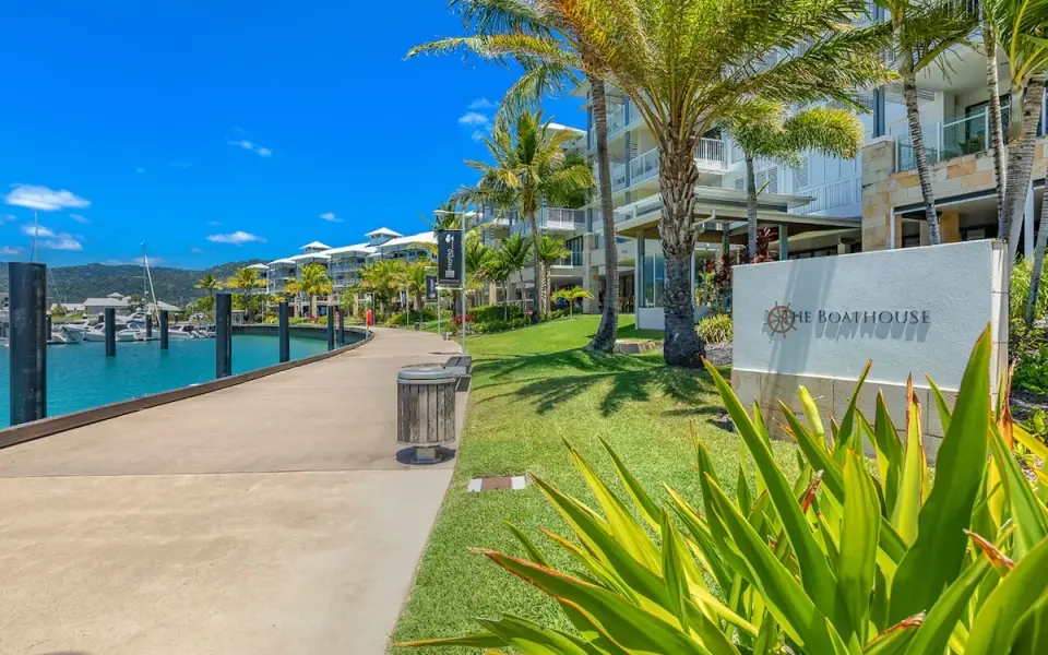 The Boathouse Apartments waterfront building and marina frontage